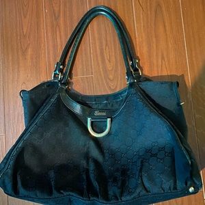 Gucci black handbag. Used. Signs of wear. Sold as is. Look at pictures